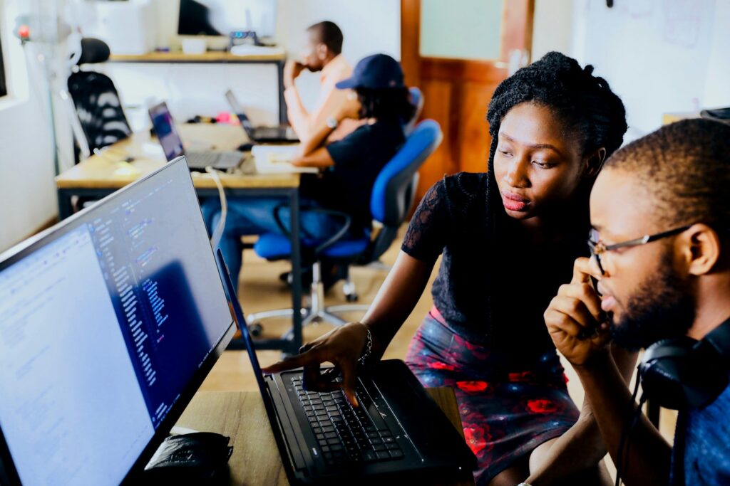Two businesspeople comparing custom software vs off the shelf software